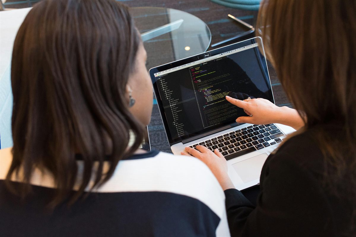 Development team collaborating on software code